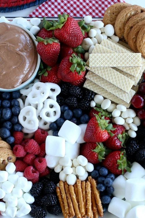 dessert charcuterie board with sweets and fruit