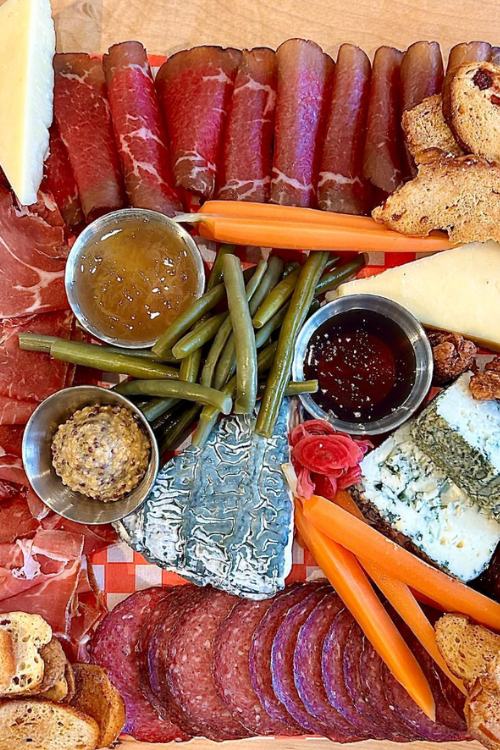 charcuterie board with meat and cheese