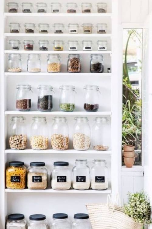 glass jars on a shelf for small kitchen organization