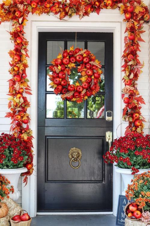 front door decorated with apple wreath