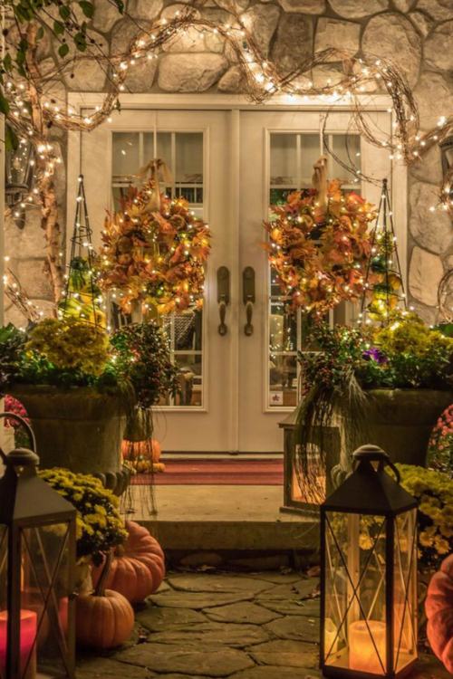 fall front porch with two wreaths and lights