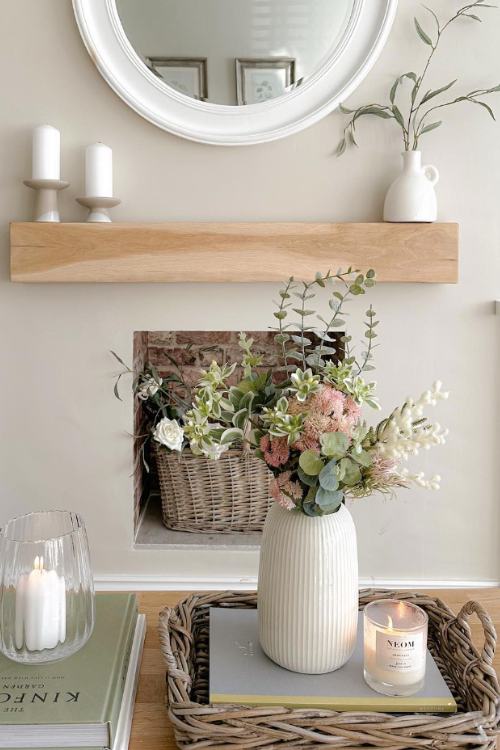 non-working fireplace with basket of flowers inside