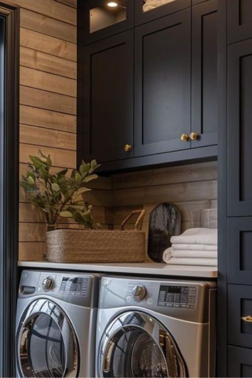 laundry room with black cabinets 