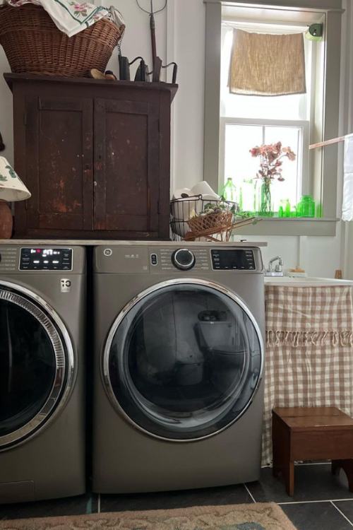 laundry room with vintage furniture and baskets