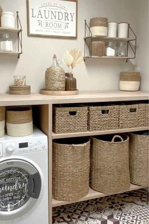 laundry room with basket storage and framed laundry sign