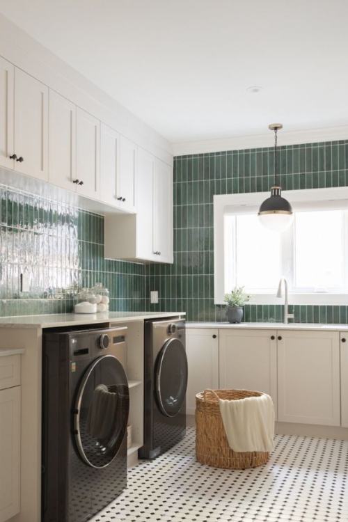 laundry room with glossy green wall tiles