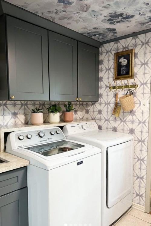 laundry room with wallpaper on wall and ceiling