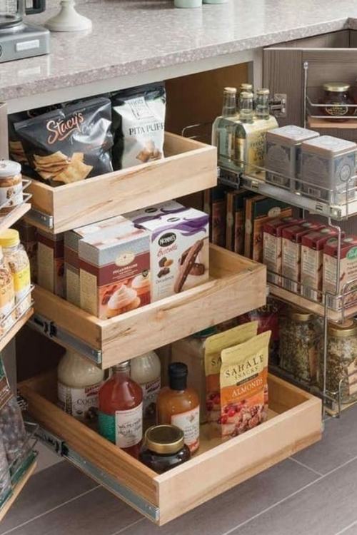 pull out cabinet organizer filled with food for small kitchen organization