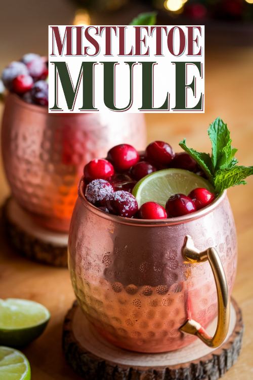 copper moscow mule glass filled with beverage and cranberry garnish