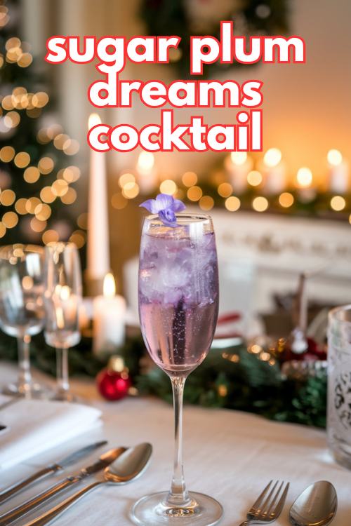 purple winter cocktail in champagne flute and violet as garnish